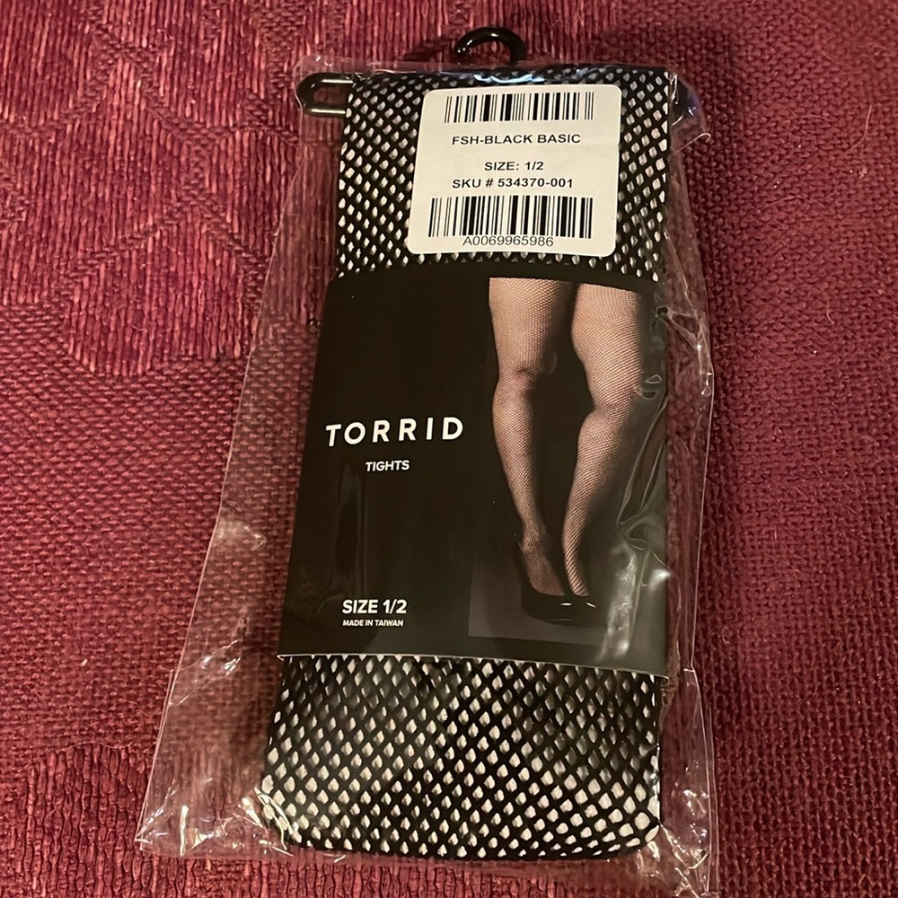 NWT Torrid fishnet tights size 1/2 black, package never opened.